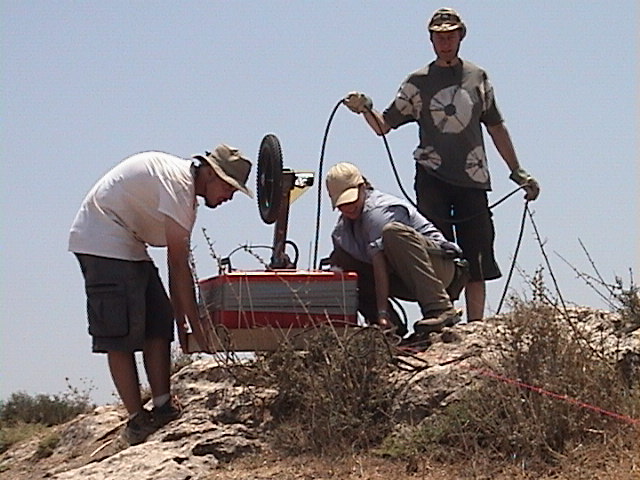 Jessie Pincus hefts the GSSI 200 MHz Antenna in 2004 at Tell es-Safi/Gath tracking the ancient siege trench which surrounded the Tell