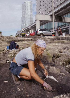 Anthropologist Dr. Alison Elgart-Berry searching for artifacts in downtown Miami